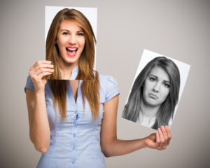 Woman changing mood with picture