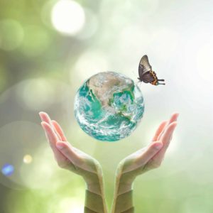 woman-holiding-globe-and-butterfly
